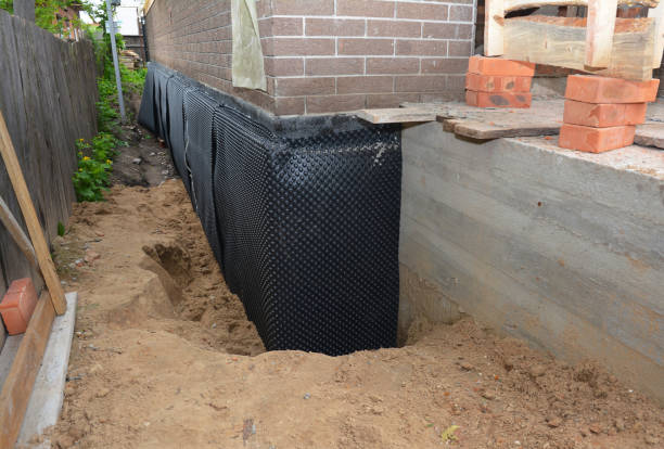 Happy homeowners after waterproofing job in Fruitport